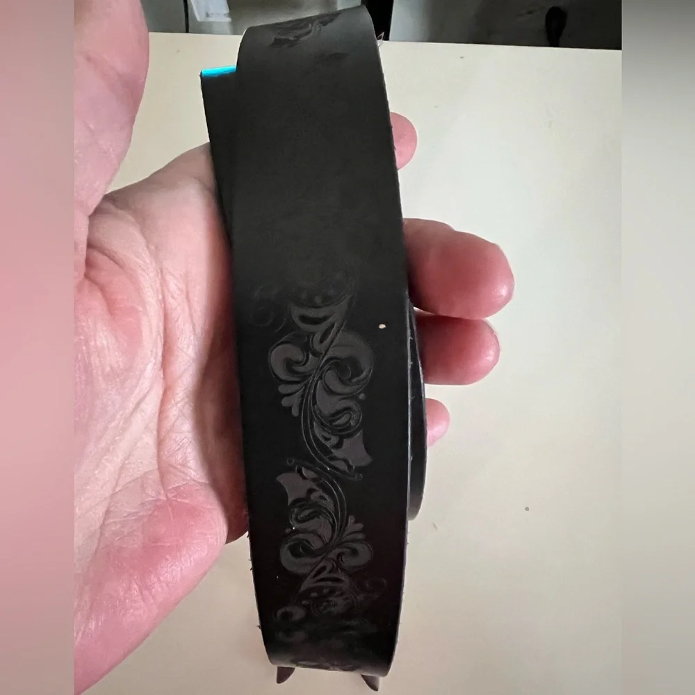 Timberland black leather belt laser etched floral design. Silver art deco buckle